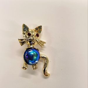 Vintage small gold tone kitty cat brooch blue glass stomach and rhinestone eyes